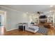 Bright living room features hardwood floors, a fireplace, and comfortable seating at 7130 Spalding Ne Ct, Atlanta, GA 30328