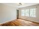 Bedroom featuring hardwood floors and a bright window providing ample light at 1239 Avonwood Sw Cir, Atlanta, GA 30311