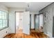 A bedroom with a window, access to a bathroom, and wood flooring at 1239 Avonwood Sw Cir, Atlanta, GA 30311