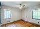 Inviting bedroom with hardwood floors, two large windows, and ample natural light at 1239 Avonwood Sw Cir, Atlanta, GA 30311