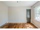 Bedroom featuring hardwood floors, a window, and neutral walls at 1239 Avonwood Sw Cir, Atlanta, GA 30311
