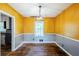 Cozy dining room with hard wood floors and abundant light streaming in through the window at 1239 Avonwood Sw Cir, Atlanta, GA 30311