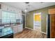 Well-lit kitchen offering white cabinets, wood flooring, and stainless steel appliances at 1239 Avonwood Sw Cir, Atlanta, GA 30311