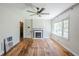 Comfortable living room with fireplace, hard wood floors, and great natural light at 1239 Avonwood Sw Cir, Atlanta, GA 30311