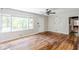 Spacious living room featuring hardwood floors, large windows, and a ceiling fan at 1239 Avonwood Sw Cir, Atlanta, GA 30311