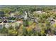 This aerial view shows the property nestled in a lush, green neighborhood with mature trees and well-maintained homes at 1903 River Birch Ln, Atlanta, GA 30316