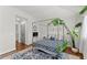 Bedroom with canopy bed, hardwood floors, and tropical plants create a unique and relaxing space at 1903 River Birch Ln, Atlanta, GA 30316
