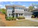 Charming two-story home with gray siding, white trim, and a manicured lawn, showcasing its curb appeal at 1903 River Birch Ln, Atlanta, GA 30316