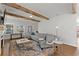 Spacious living room features exposed beams, stylish furniture and ample natural light at 1903 River Birch Ln, Atlanta, GA 30316