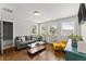 Bright living room featuring modern furniture, hardwood floors, and natural light from multiple windows at 1903 River Birch Ln, Atlanta, GA 30316