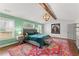 Bright main bedroom with green textured wall, exposed beam, and a luxurious bed at 1903 River Birch Ln, Atlanta, GA 30316