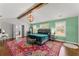 Beautiful main bedroom with exposed beam, ensuite bathroom and decorative rug at 1903 River Birch Ln, Atlanta, GA 30316