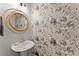 Chic powder room featuring stylish floral wallpaper and a modern vanity at 1903 River Birch Ln, Atlanta, GA 30316