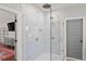 Large walk in shower with glass enclosure, rain style shower head, and built-in niche for added convenience at 1903 River Birch Ln, Atlanta, GA 30316