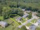 An aerial view of a suburban home with a spacious lot outlined in yellow, showcasing its prime location at 4481 Lucerne Sw Pl, Lilburn, GA 30047