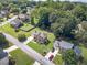 Aerial shot of a charming home surrounded by lush greenery and well-manicured lawns in a quiet neighborhood at 4481 Lucerne Sw Pl, Lilburn, GA 30047