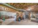 Unfinished basement with exposed ceiling, concrete floor, water heater, providing a blank canvas for storage or potential expansion at 4481 Lucerne Sw Pl, Lilburn, GA 30047