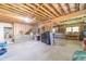 Spacious unfinished basement with concrete floor, exposed wood ceiling, framing, offering potential for customized renovations and upgrades at 4481 Lucerne Sw Pl, Lilburn, GA 30047