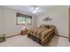 Bedroom with a large window, carpeting, and decorative touches at 4481 Lucerne Sw Pl, Lilburn, GA 30047