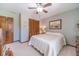 Bedroom featuring carpeted floor, ceiling fan, closet, and dresser at 4481 Lucerne Sw Pl, Lilburn, GA 30047