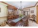Spacious dining room with a large table, perfect for gatherings and meals at 4481 Lucerne Sw Pl, Lilburn, GA 30047