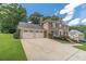 Charming brick home with a well-manicured lawn and a spacious driveway at 4481 Lucerne Sw Pl, Lilburn, GA 30047