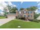 Charming brick home with well-maintained landscaping and a three-car garage at 4481 Lucerne Sw Pl, Lilburn, GA 30047