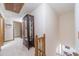 Spacious upstairs hallway with wood railing and a display cabinet at 4481 Lucerne Sw Pl, Lilburn, GA 30047
