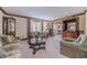 Comfortable living room featuring neutral walls, wood trim, and classic furnishings at 4481 Lucerne Sw Pl, Lilburn, GA 30047