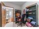 Comfortable office space with built-in desk, bookshelves, and access to the laundry room at 4481 Lucerne Sw Pl, Lilburn, GA 30047