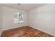 Bright bedroom with laminate floors and ample natural light from single window at 3987 Bayside Cir, Atlanta, GA 30340