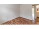 Bedroom with wood floors featuring a view of the attached bathroom and a sliding door out to the deck at 3987 Bayside Cir, Atlanta, GA 30340