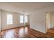 Bedroom features wood-look flooring, closet with mirrored doors, and natural light from two windows at 3987 Bayside Cir, Atlanta, GA 30340