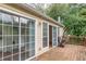 View of wooden deck with grill and sliding glass doors to adjacent room at 3987 Bayside Cir, Atlanta, GA 30340