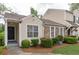 Charming townhome with stone accents, well-maintained landscaping, and inviting front porch at 3987 Bayside Cir, Atlanta, GA 30340