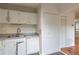 Bright eat-in kitchen features dishwasher and tile backsplash with ample cabinet space at 3987 Bayside Cir, Atlanta, GA 30340