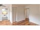 Spacious living area with hardwood floors, closet, and a view of the kitchen at 3987 Bayside Cir, Atlanta, GA 30340
