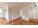 Bright living area with hardwood floors, closet, and a view of the kitchen with a white stove at 3987 Bayside Cir, Atlanta, GA 30340