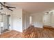 Open living area with hardwood floors, laundry closet, and a view of the kitchen at 3987 Bayside Cir, Atlanta, GA 30340