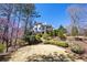 Back exterior of house showcasing the tiered landscaping and elevated decks at 4620 Chattahoochee Se Xing, Marietta, GA 30067