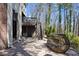 Backyard featuring a stone patio with seating area and stairs to upper deck at 4620 Chattahoochee Se Xing, Marietta, GA 30067