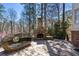 Enjoy outdoor living with a stone fireplace and unique seating area in the backyard at 4620 Chattahoochee Se Xing, Marietta, GA 30067