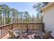 Relax on the wooden balcony with scenic views of the surrounding greenery at 4620 Chattahoochee Se Xing, Marietta, GA 30067