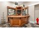 Finished basement bar featuring wood paneling, ample shelving, and stone accents at 4620 Chattahoochee Se Xing, Marietta, GA 30067