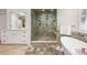 Modern bathroom with a frameless glass shower, soaking tub, and stylish tile at 4620 Chattahoochee Se Xing, Marietta, GA 30067