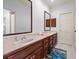 Elegant bathroom featuring dual sinks, a large mirror, and classic wood cabinetry at 4620 Chattahoochee Se Xing, Marietta, GA 30067