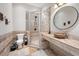 Bathroom featuring a stone counter, travertine tile and glass enclosed shower at 4620 Chattahoochee Se Xing, Marietta, GA 30067