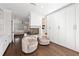 Bedroom with fireplace, built-in shelving, and dark hardwood flooring at 4620 Chattahoochee Se Xing, Marietta, GA 30067