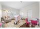 Bright bedroom featuring a playful ' area with a tent and a comfortable couch at 4620 Chattahoochee Se Xing, Marietta, GA 30067