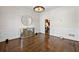 Dining room with crown molding, wood floors, and modern light fixture at 4620 Chattahoochee Se Xing, Marietta, GA 30067